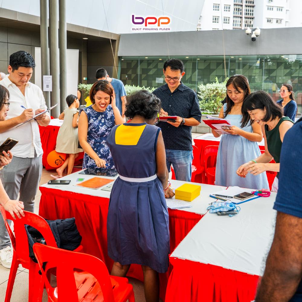 Attendees interacting with game creators