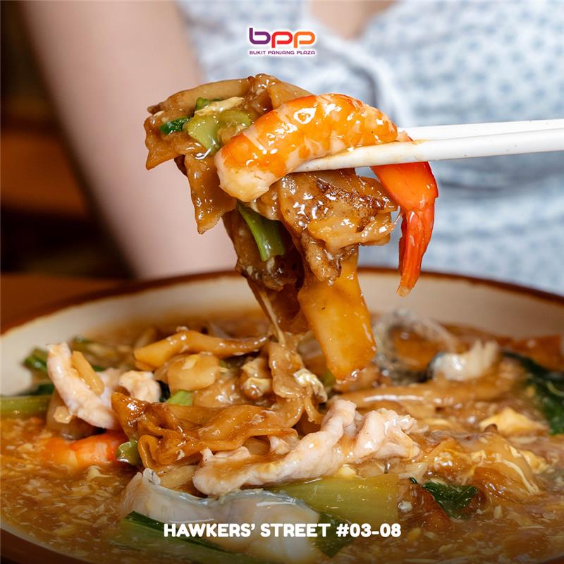 Diners enjoying a vibrant culinary experience at Bukit Panjang Plaza