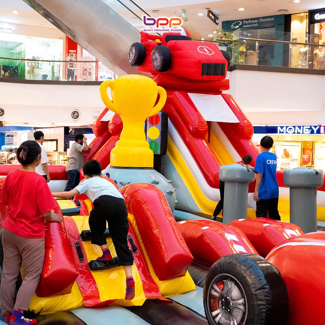 A colorful inflatable obstacle course at Jumptopia Lite event