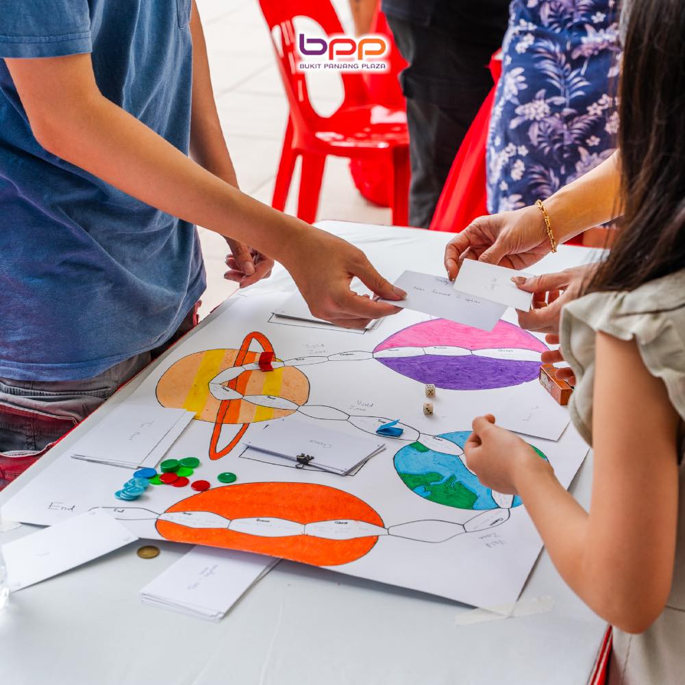 Families engaging with Singapore-themed board games