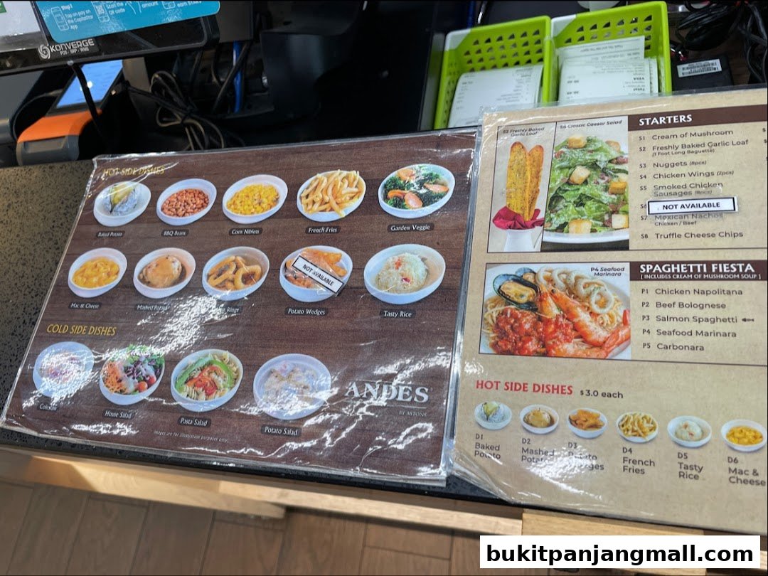 A menu display showing various side dishes, starters, and spaghetti options.