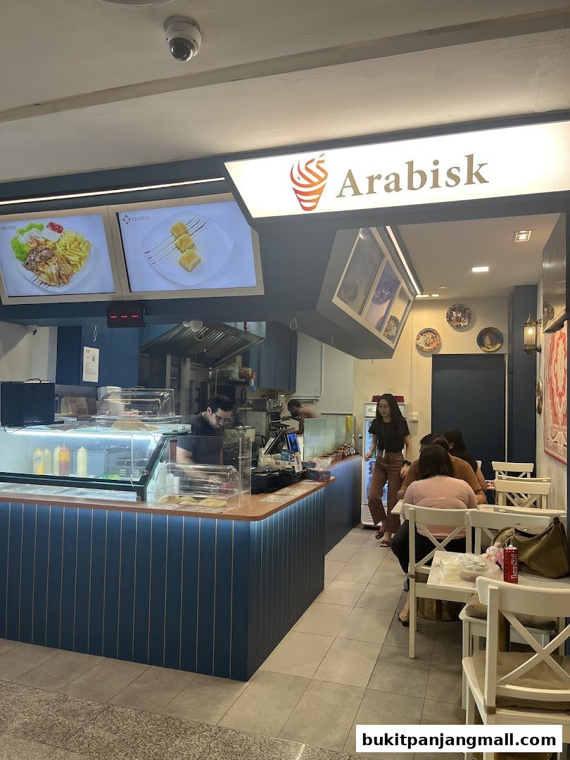 Interior view of ArabiskSG restaurant with staff and customers dining.
