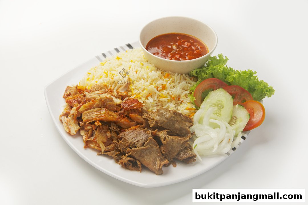 A plate of Arabic food with rice, grilled meats, salad, and sauce.