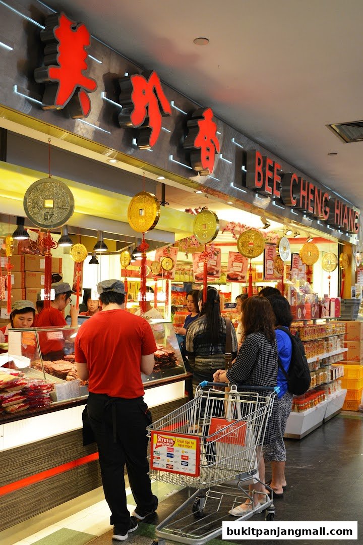 Customers are queuing at Bee Cheng Hiang, a shop selling dried meat products.