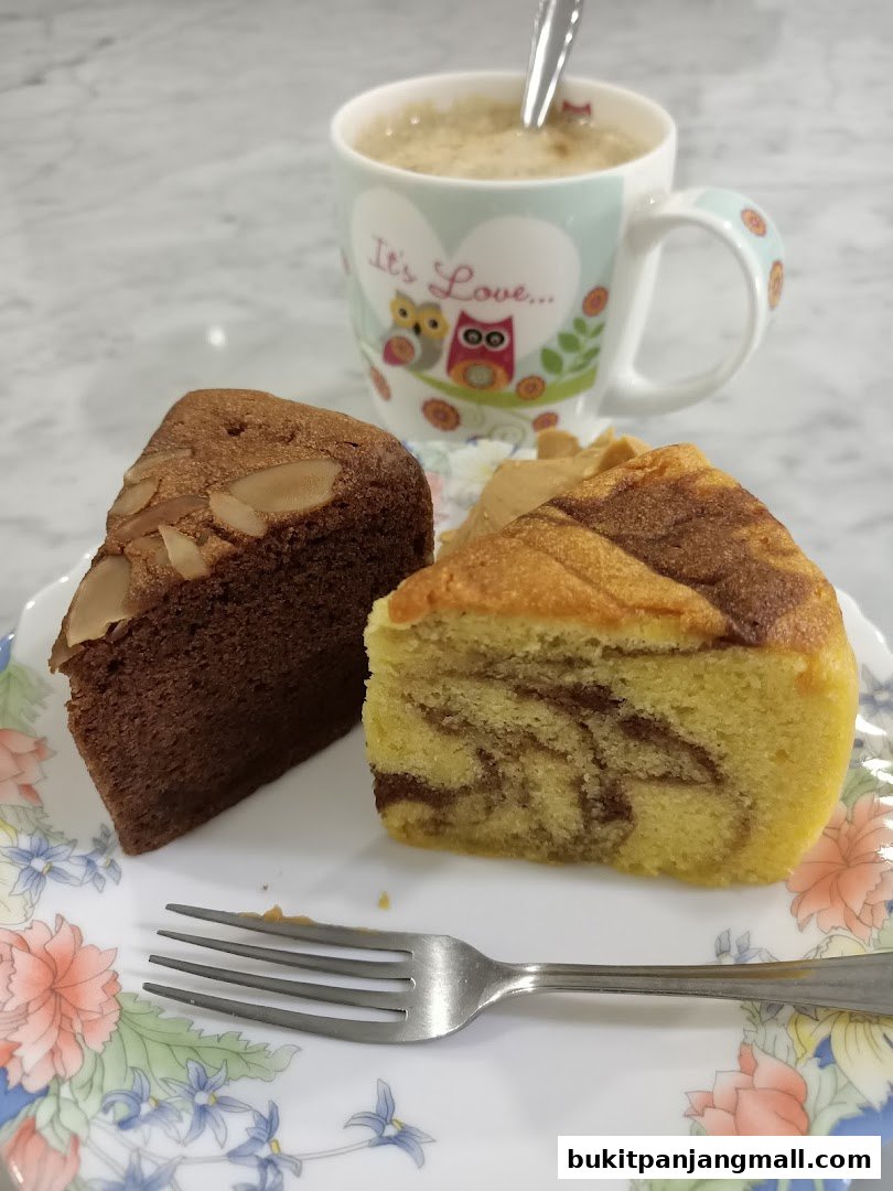 Two slices of cake and a cup of coffee on a floral plate.