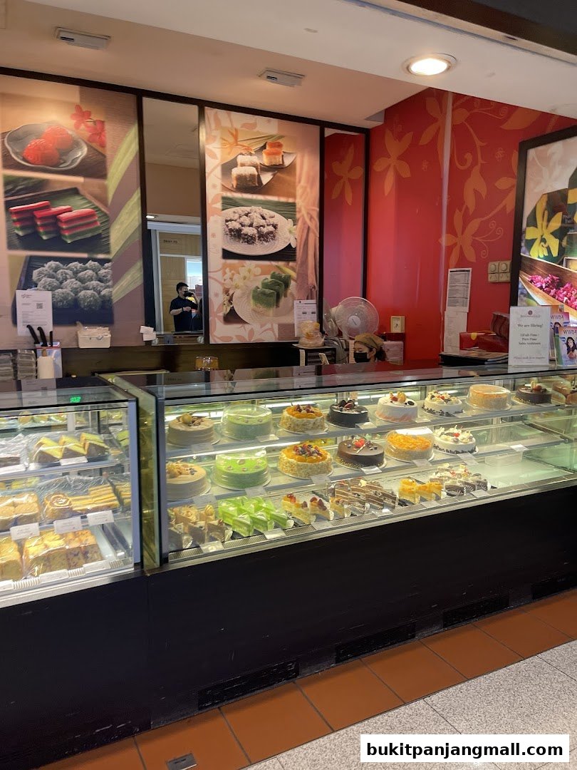 A display case filled with various cakes and pastries at Bengawan Solo.