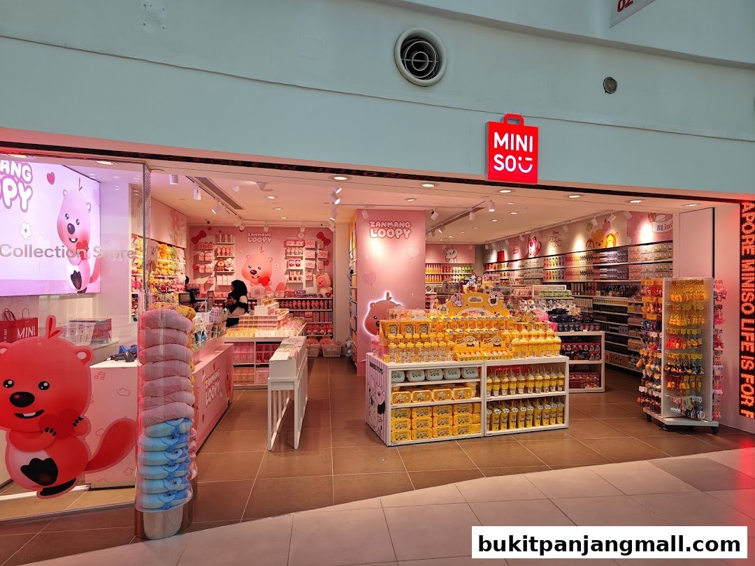 A brightly lit MINISO store featuring 'Zanmang Loopy' merchandise and a cheerful pink interior.