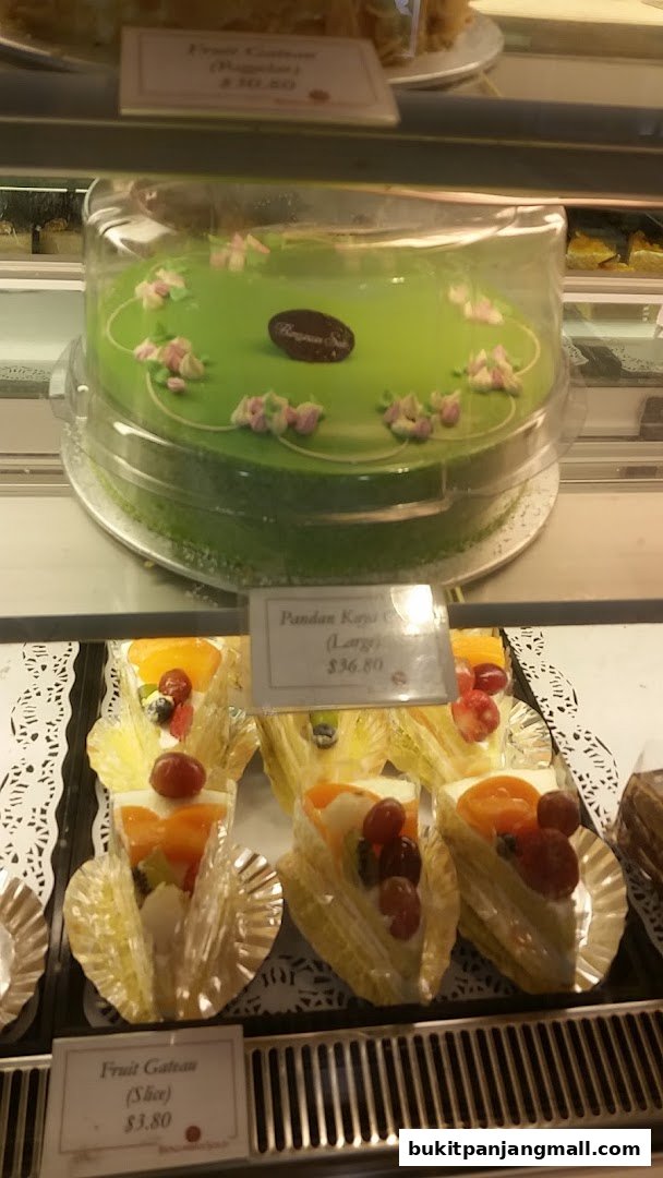 A display case filled with delicious cakes and pastries from Bengawan Solo.