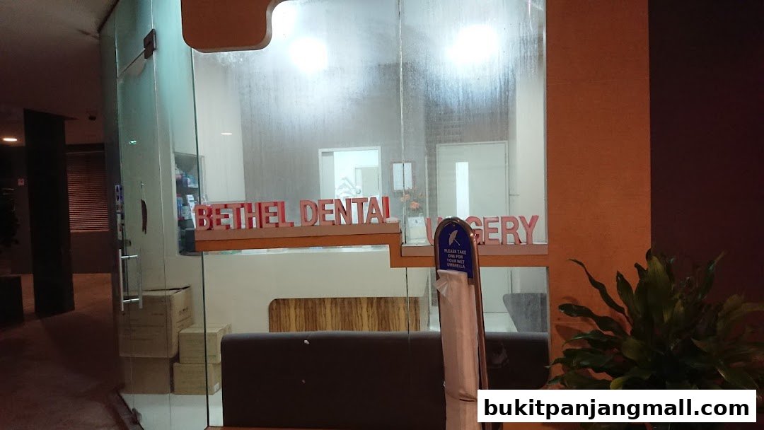 The entrance of Bethel Dental Surgery with its name displayed on the glass facade.