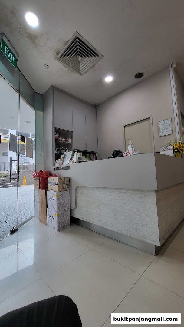 The reception area of Bethel Dental Surgery with a counter, cabinets, and boxes.