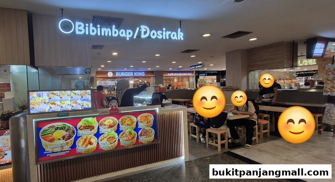 A Korean food stall named Bibimbap/Dosirak with a vibrant display of dishes and seating area.