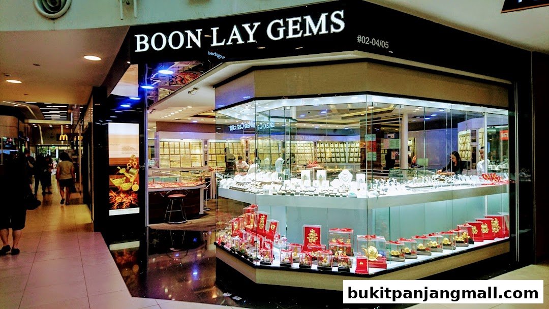 A well-lit jewelry store with a wide display of gold and diamond jewelry.
