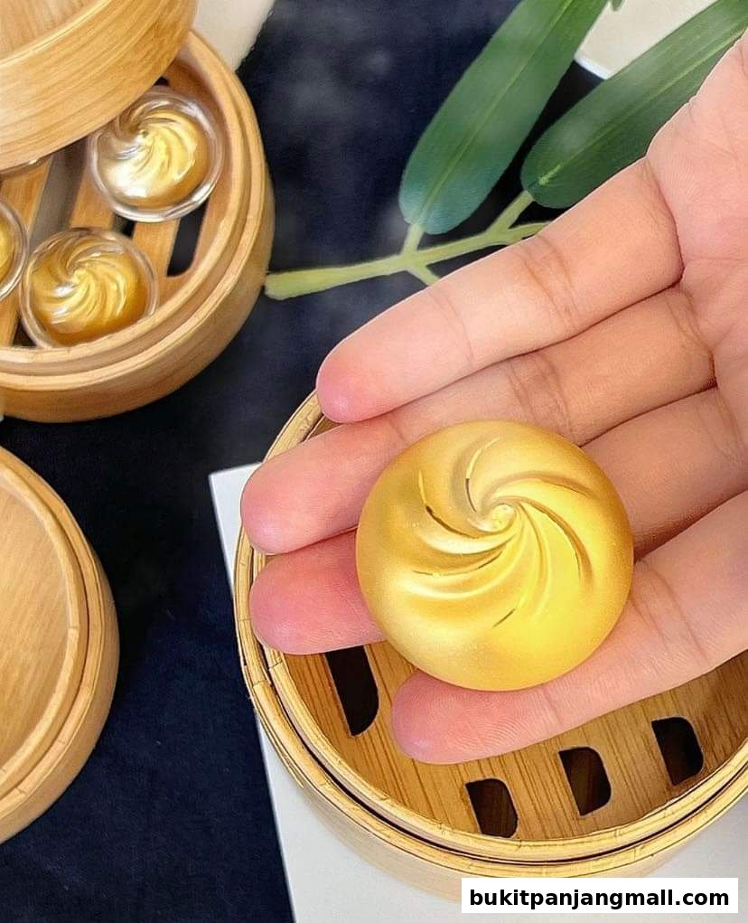 A hand holds a golden, swirled pastry over a bamboo steamer basket.