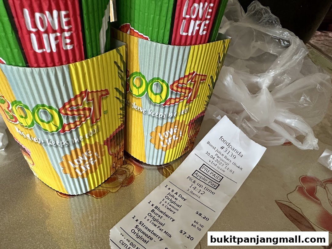 Boost Juice cups and a foodpanda receipt with juice orders.