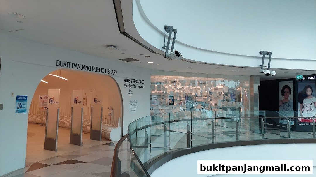 The entrance to Bukit Panjang Public Library with signage and seating.