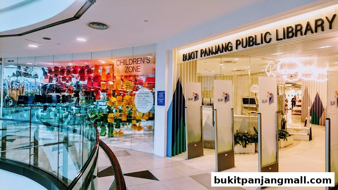 The entrance to Bukit Panjang Public Library, featuring a colorful children's zone and library information displays.