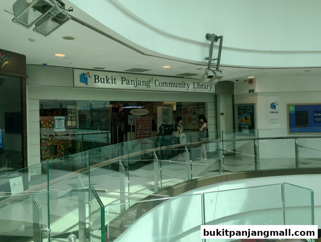 The entrance to Bukit Panjang Community Library with people inside and signage.