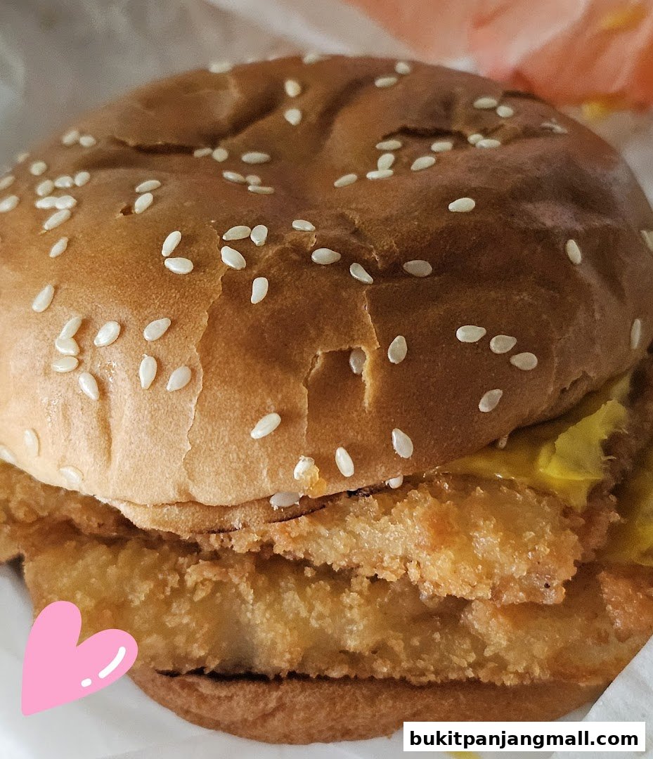 A close-up shot of a delicious Burger King chicken sandwich with sesame seeds on the bun.