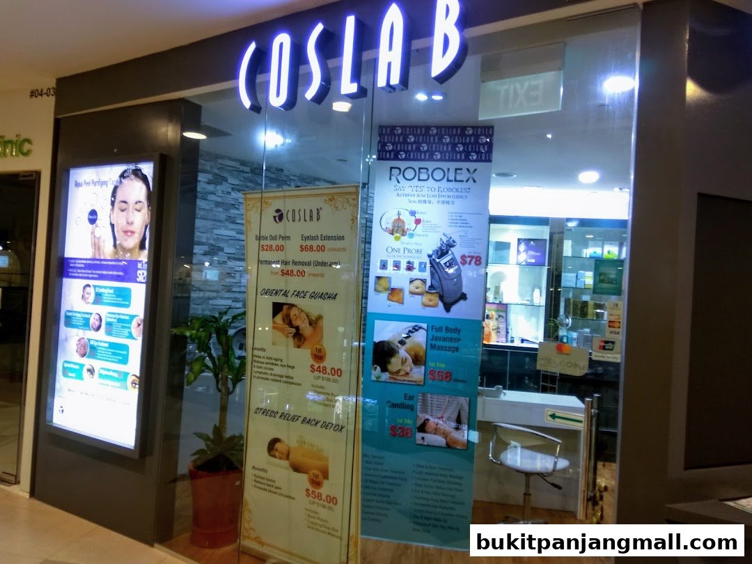 The storefront of Coslab Beauty Spa, featuring a glowing sign and promotional posters for various beauty treatments.
