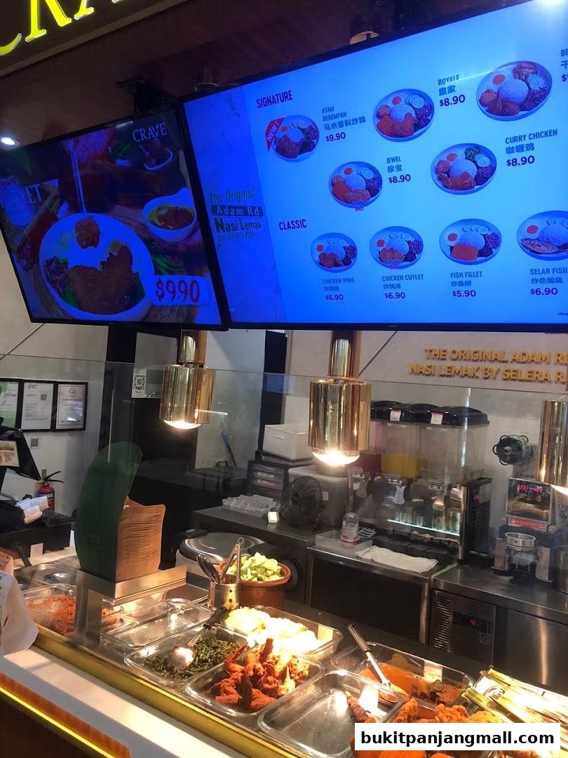 A digital menu board displaying various Nasi Lemak dishes with prices and images.