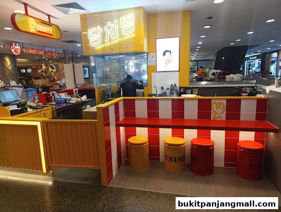 The interior of a Cravy Chicken shop with a counter, seating, and a visible kitchen area.