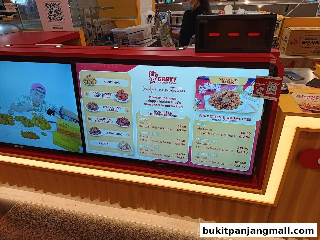 A digital menu board displaying various Korean fried chicken options and prices.