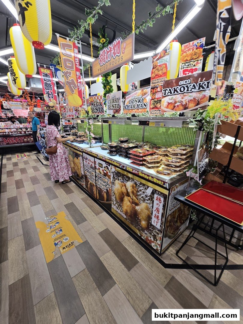 A display of pre-packaged Japanese fried foods and bentos at DON DON DONKI.