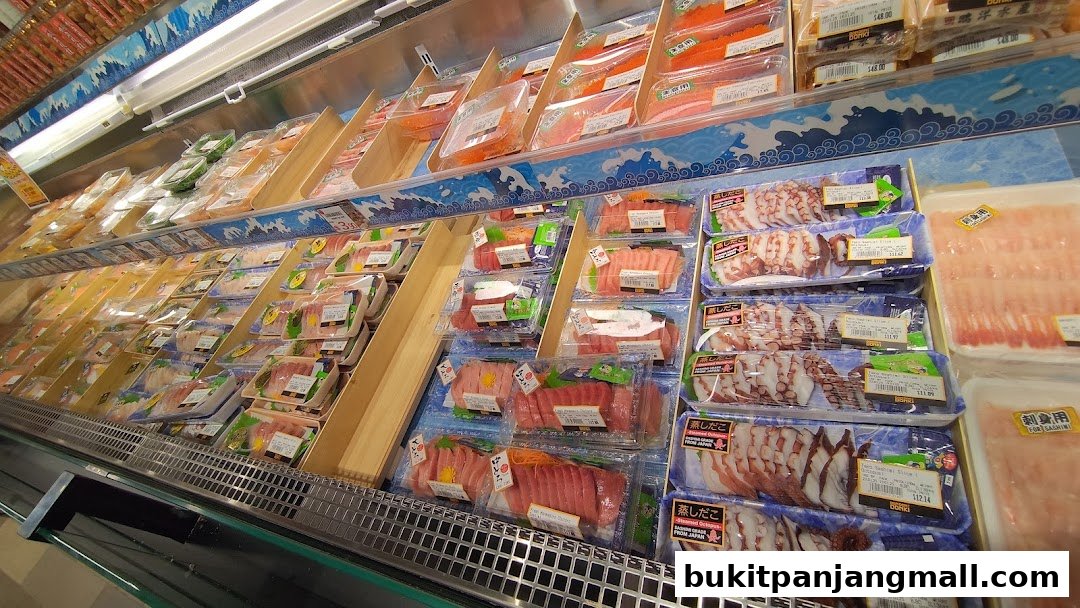A refrigerated display case filled with various pre-packaged sashimi and seafood items.