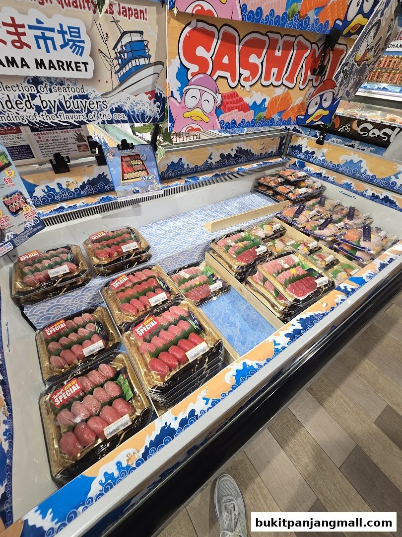 A display of fresh sushi and sashimi packages in a refrigerated case at a market.