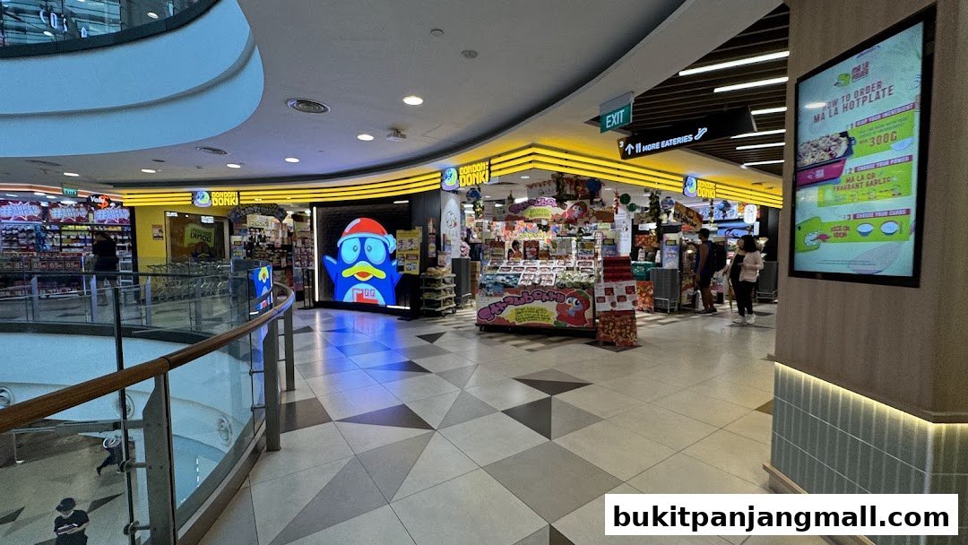 The entrance of DON DON DONKI Bukit Panjang Plaza with colorful displays and a large blue character.