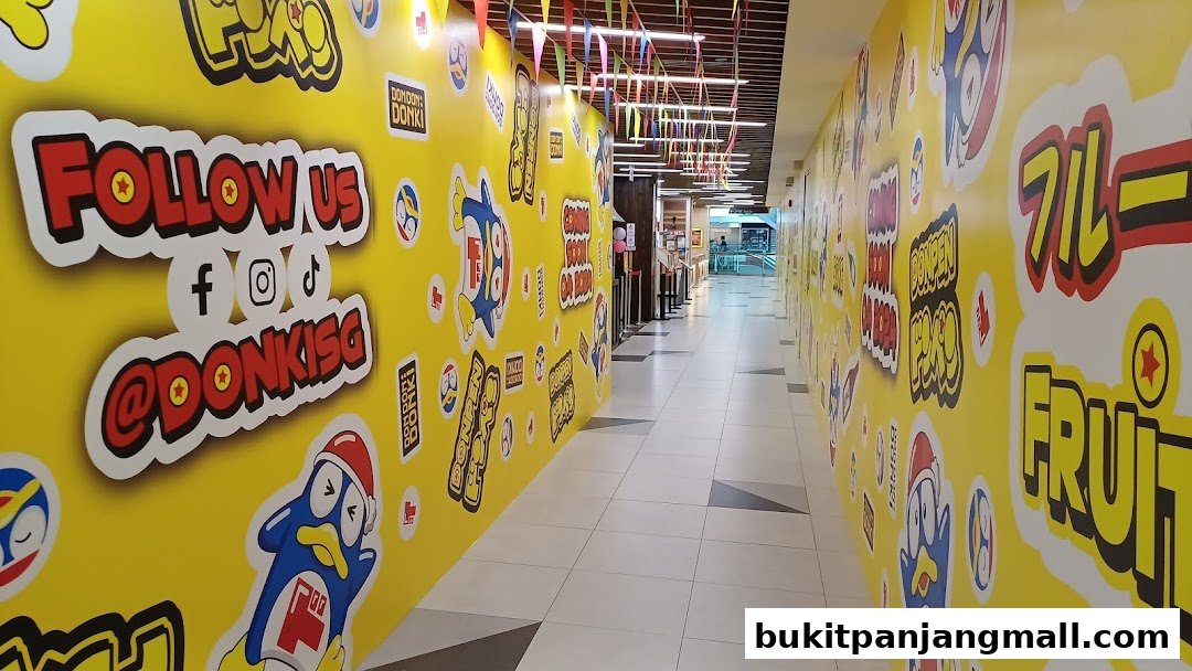 A brightly decorated hallway with yellow walls featuring cartoon characters and social media handles.