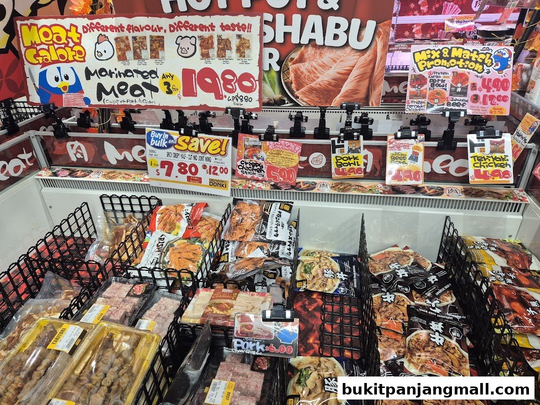 A display of marinated meats and ready-to-eat meals at DON DON DONKI Bukit Panjang Plaza.