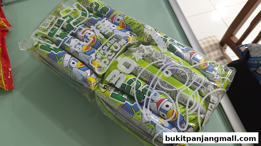 A package of green snacks featuring cartoon characters, likely from DON DON DONKI.