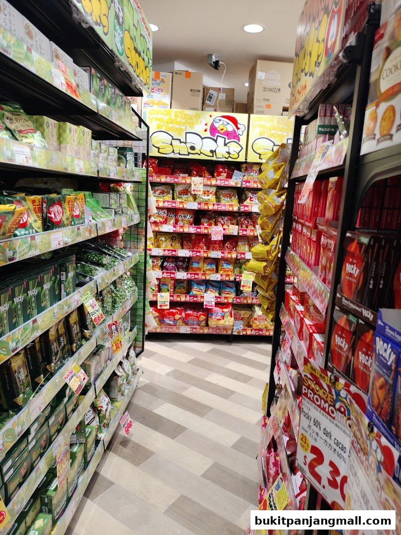 Aisle of a Japanese snack store with shelves full of various snacks and Pocky.
