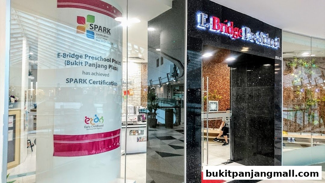 The entrance of E-Bridge Preschool Bukit Panjang, showcasing its SPARK certification and modern facade.
