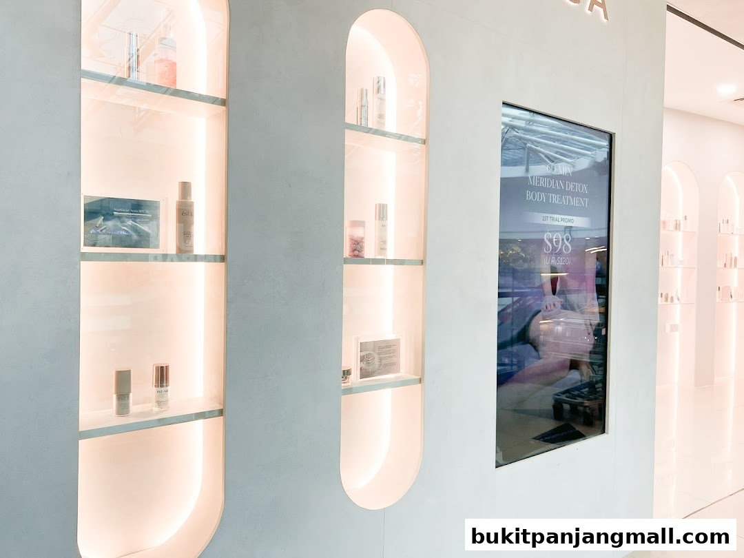 Estetica Beauty shop interior with illuminated shelves displaying skincare products and a promotional screen.