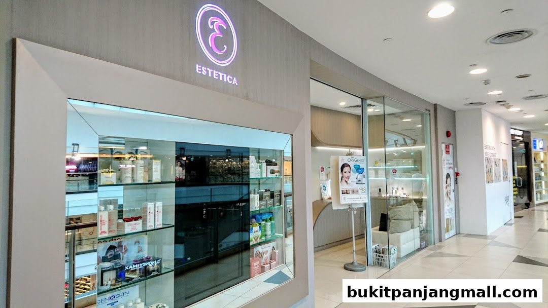 The exterior of Estetica Beauty, a modern salon with illuminated signage and display shelves.