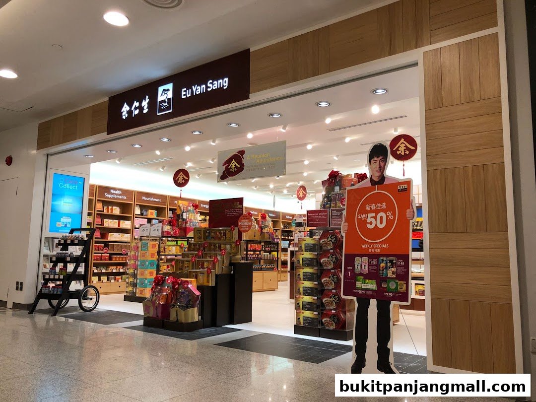 The entrance of Eu Yan Sang shop with product displays and a promotional cutout.