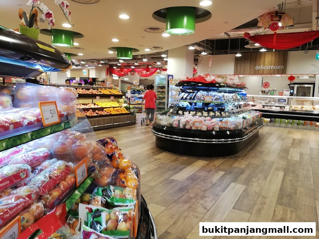 Interior view of a FairPrice Finest supermarket showcasing fresh produce and a delicatessen section.