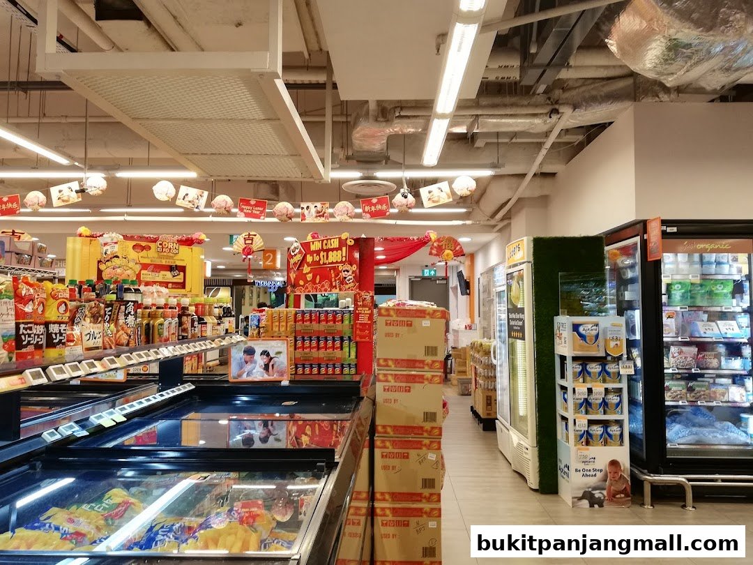 Interior view of a FairPrice Finest supermarket with aisles of groceries and refrigerated displays.