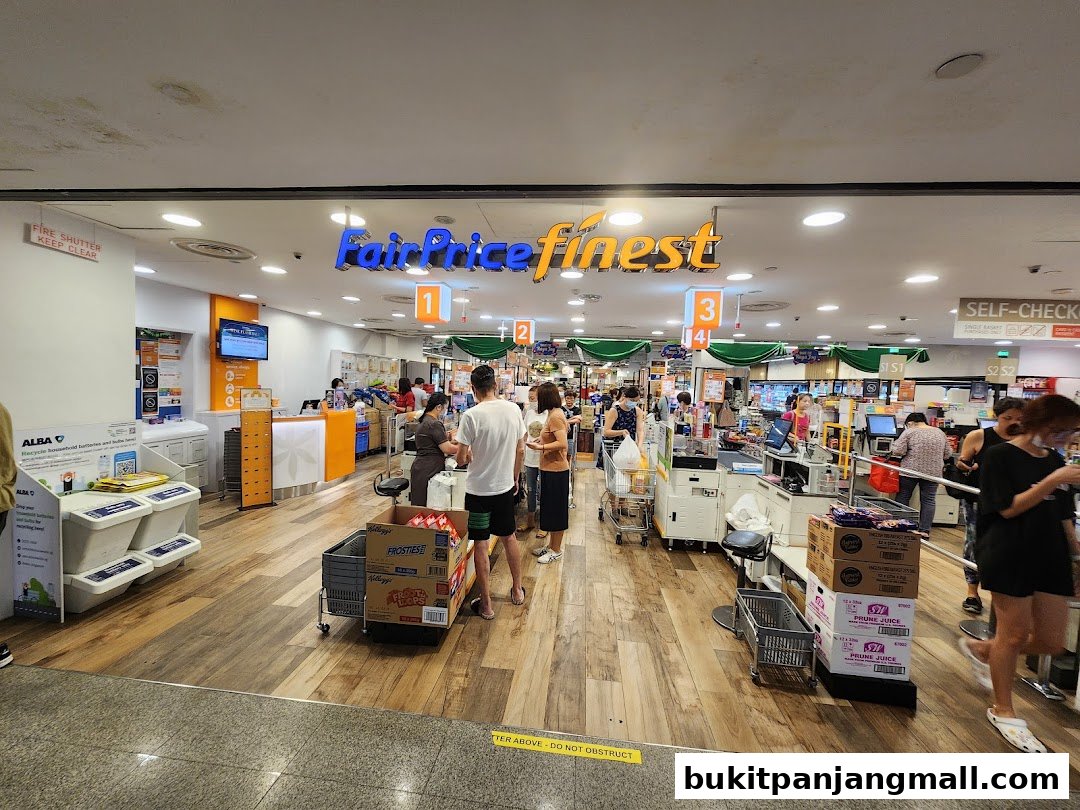 Interior view of a FairPrice Finest supermarket with shoppers and checkout counters.