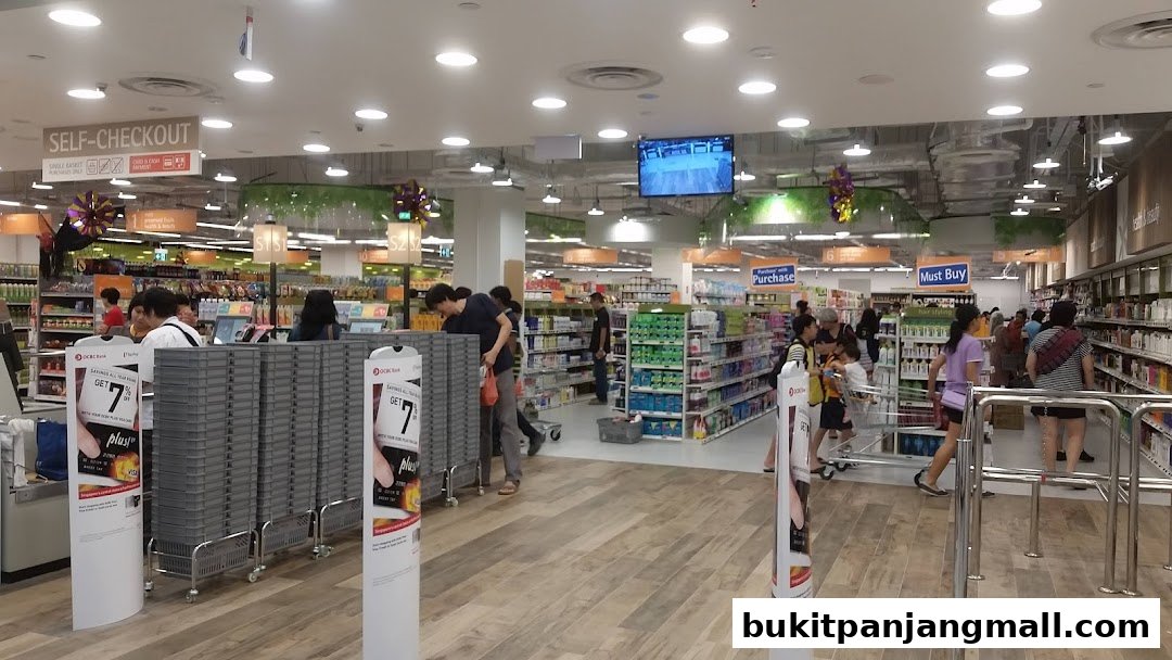 Interior view of a FairPrice Finest supermarket with shoppers and aisles of products.