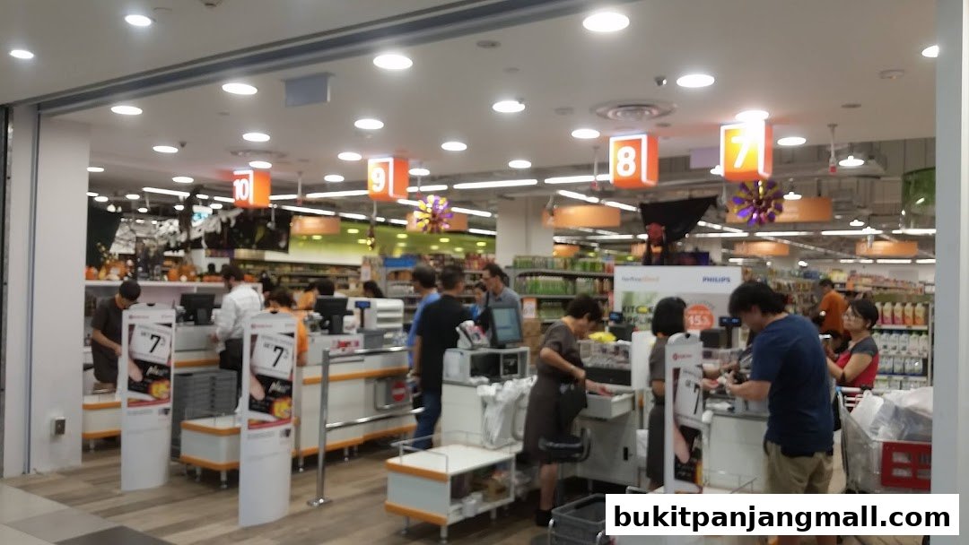 Customers are seen at the checkout counters of a FairPrice Finest supermarket.
