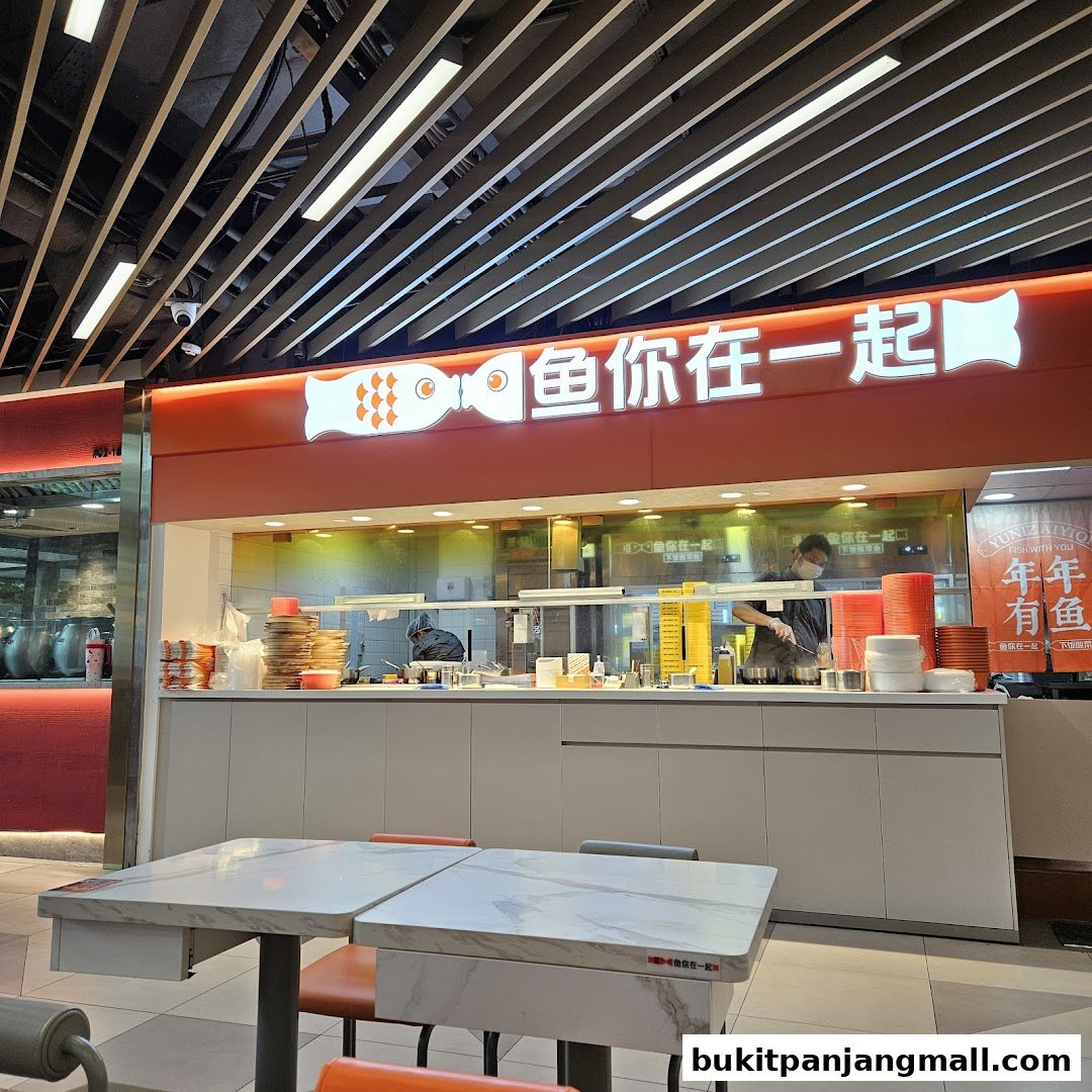The interior of a restaurant with a prominent sign and dining tables.