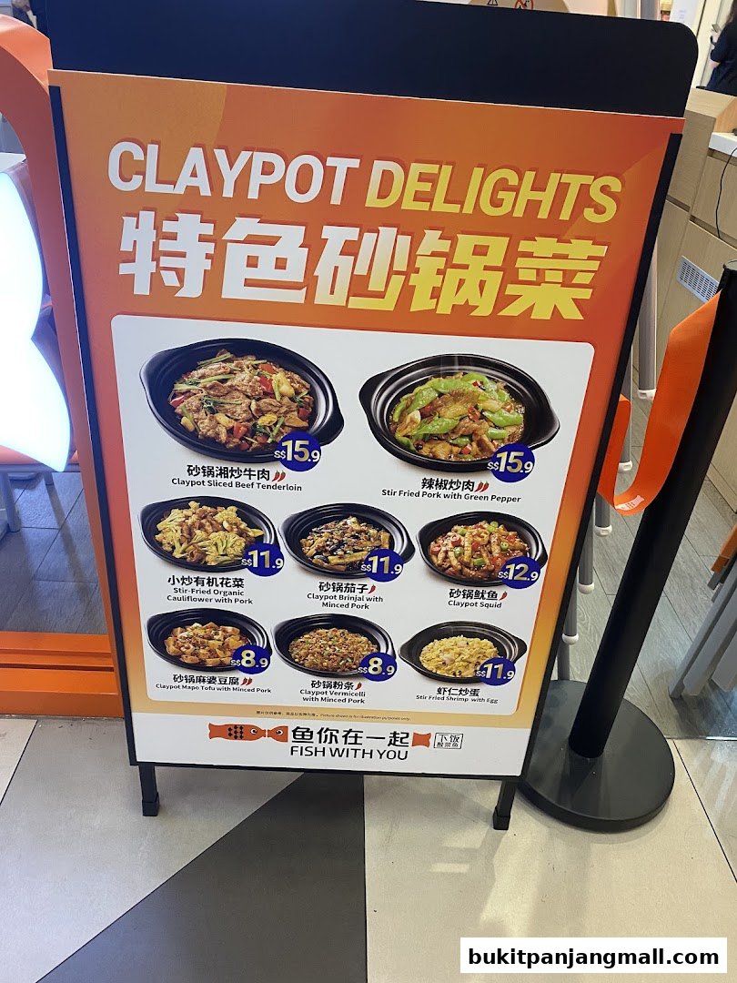 A display board showcasing various claypot dishes with their names and prices.