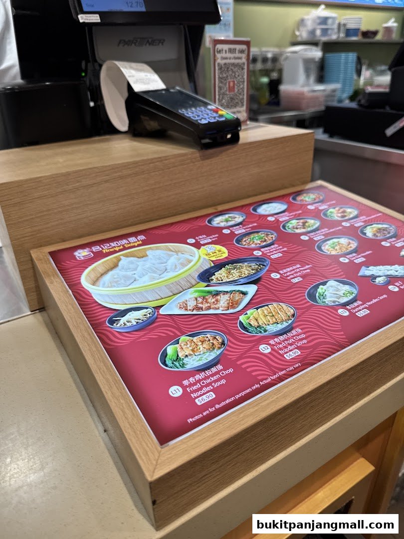 A close-up of a menu display at Flourful Delight, showcasing various noodle dishes.