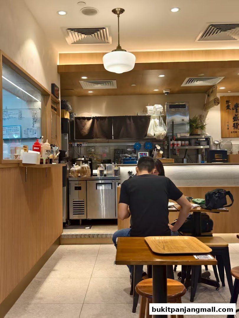 Interior view of Fong Sheng Hao with customers seated at tables and staff behind the counter.