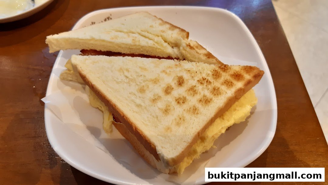 A close-up shot of a delicious sandwich with toasted bread and a creamy filling.