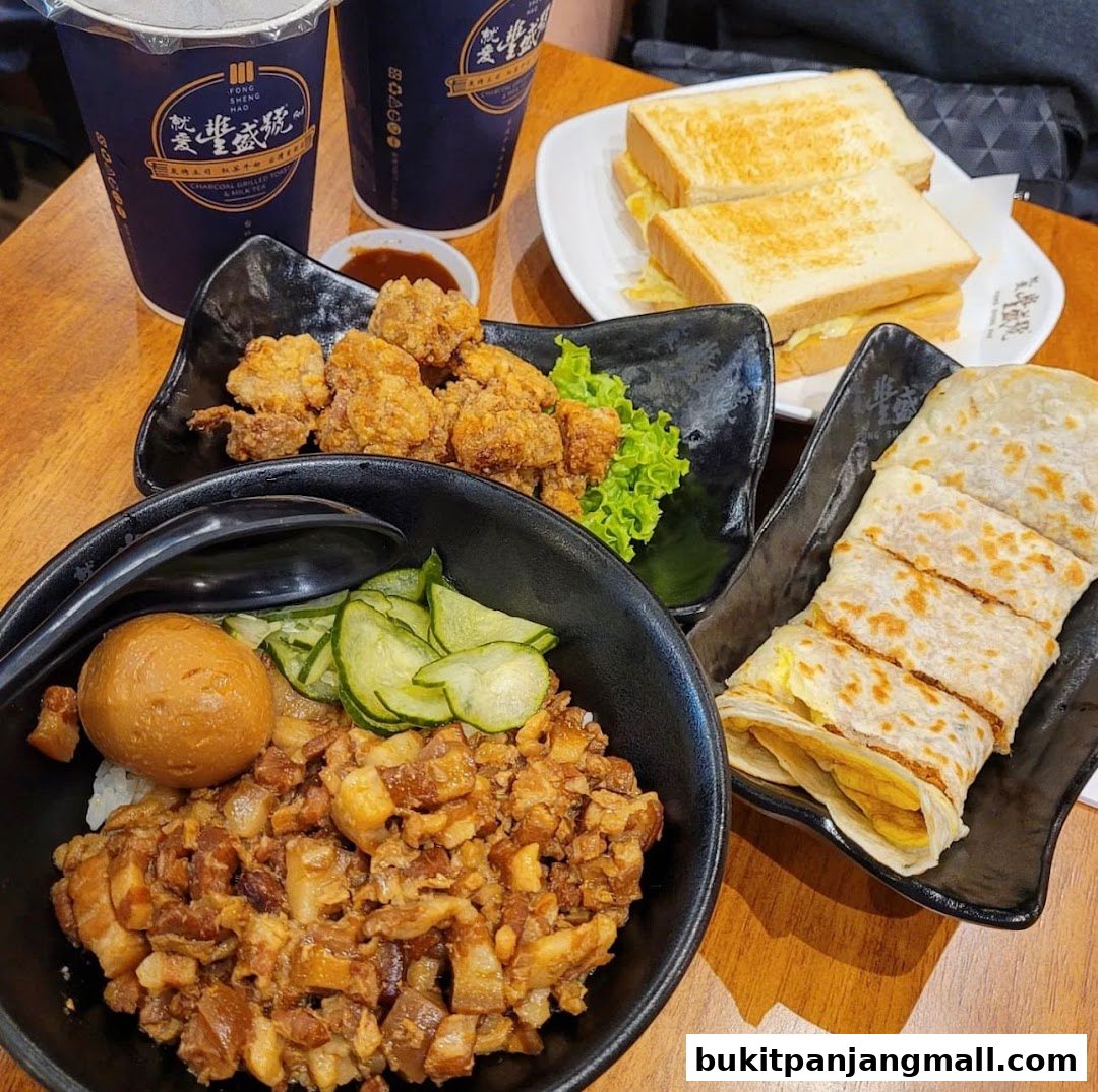 A table laden with Taiwanese street food, including braised pork rice, fried chicken, and egg crepes.