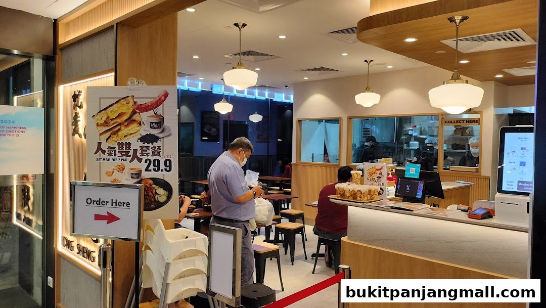 Interior view of Fong Sheng Hao with customers ordering and staff working behind the counter.